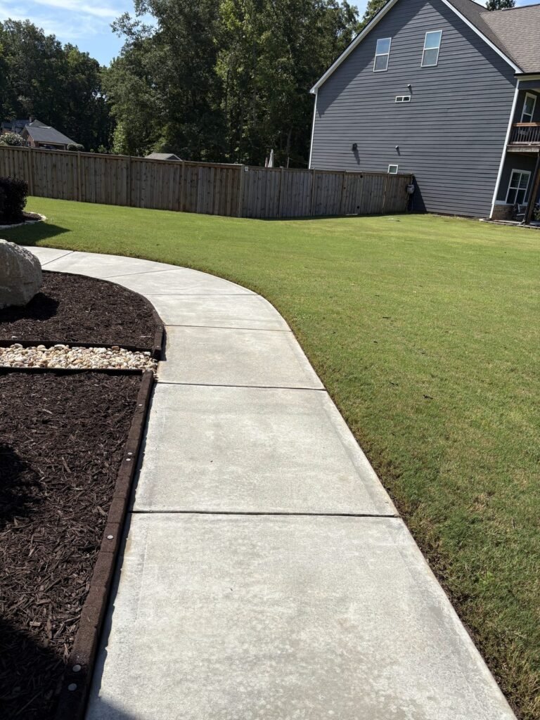 Clean sidewalk after pressure washing